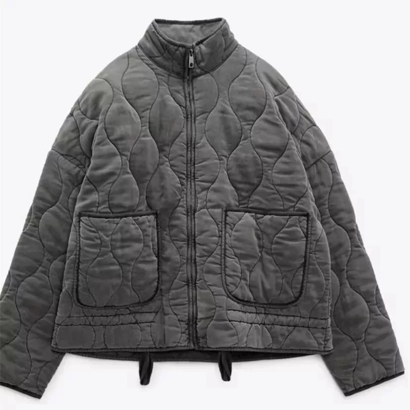Women's high collar quilted jacket in dark grey – flat view