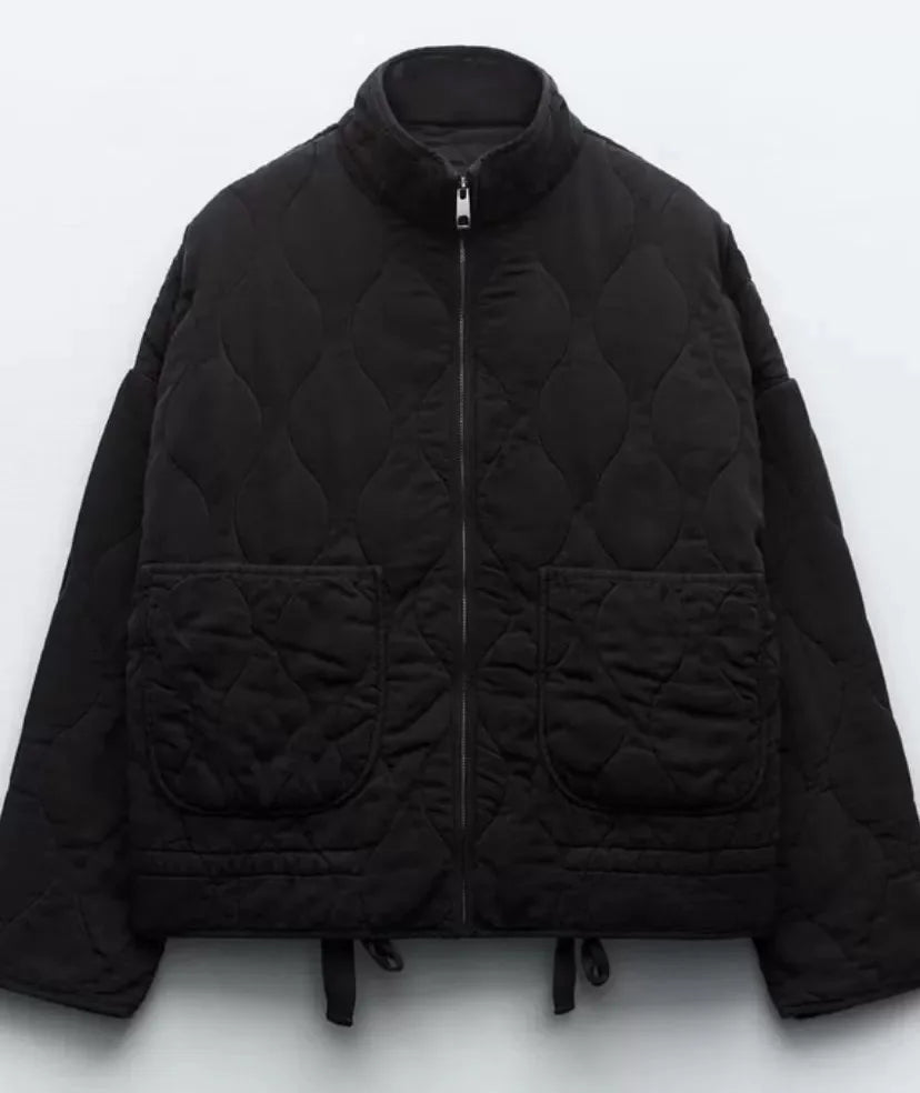 Women's high collar quilted jacket in black – flat view