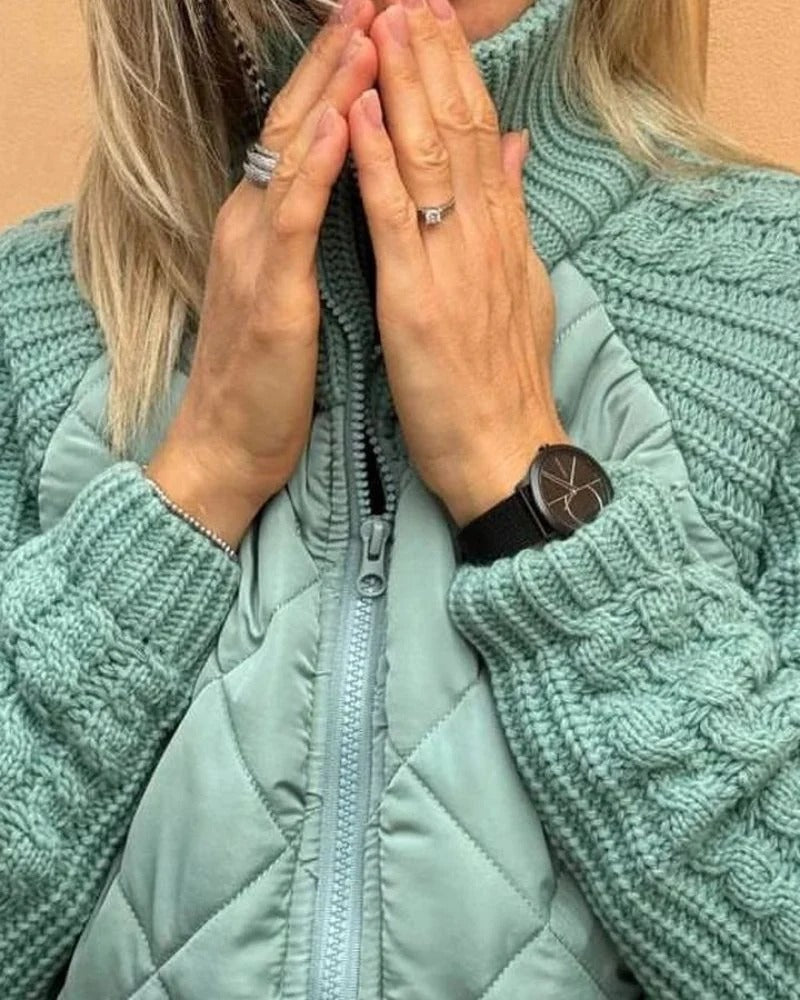 Close-up of the knit cuff on the teal jacket