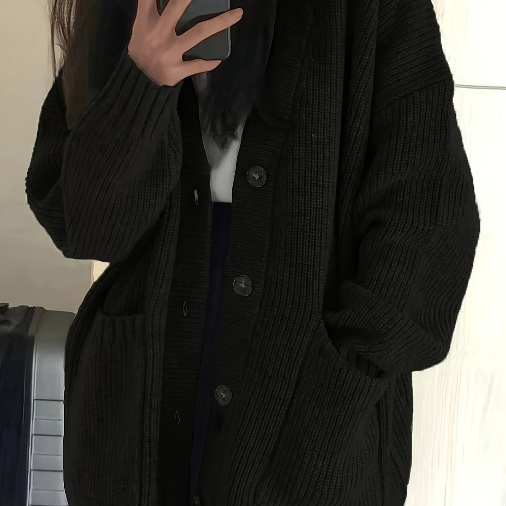 Women's relaxed button front cardigan in black – close-up