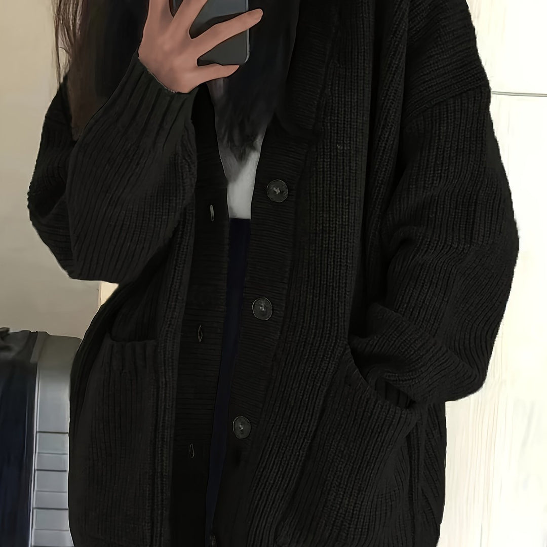 Women's relaxed button front cardigan in black – close-up
