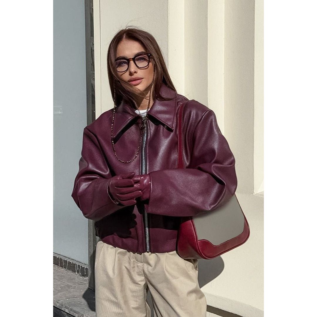 Women's relaxed leather look jacket in burgundy, styled