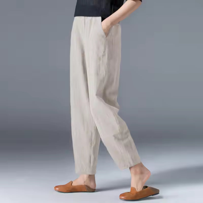 Women's relaxed tapered trousers in beige – walking