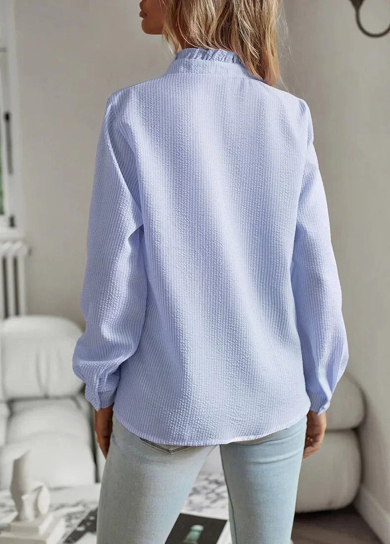 Women's ruffle trim blouse in blue – back view