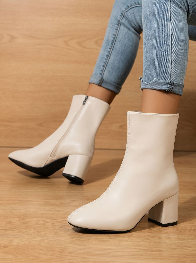 Women's sleek block heel ankle boots in cream – pair