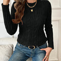 Women's slim cable knit sweater in black – front view