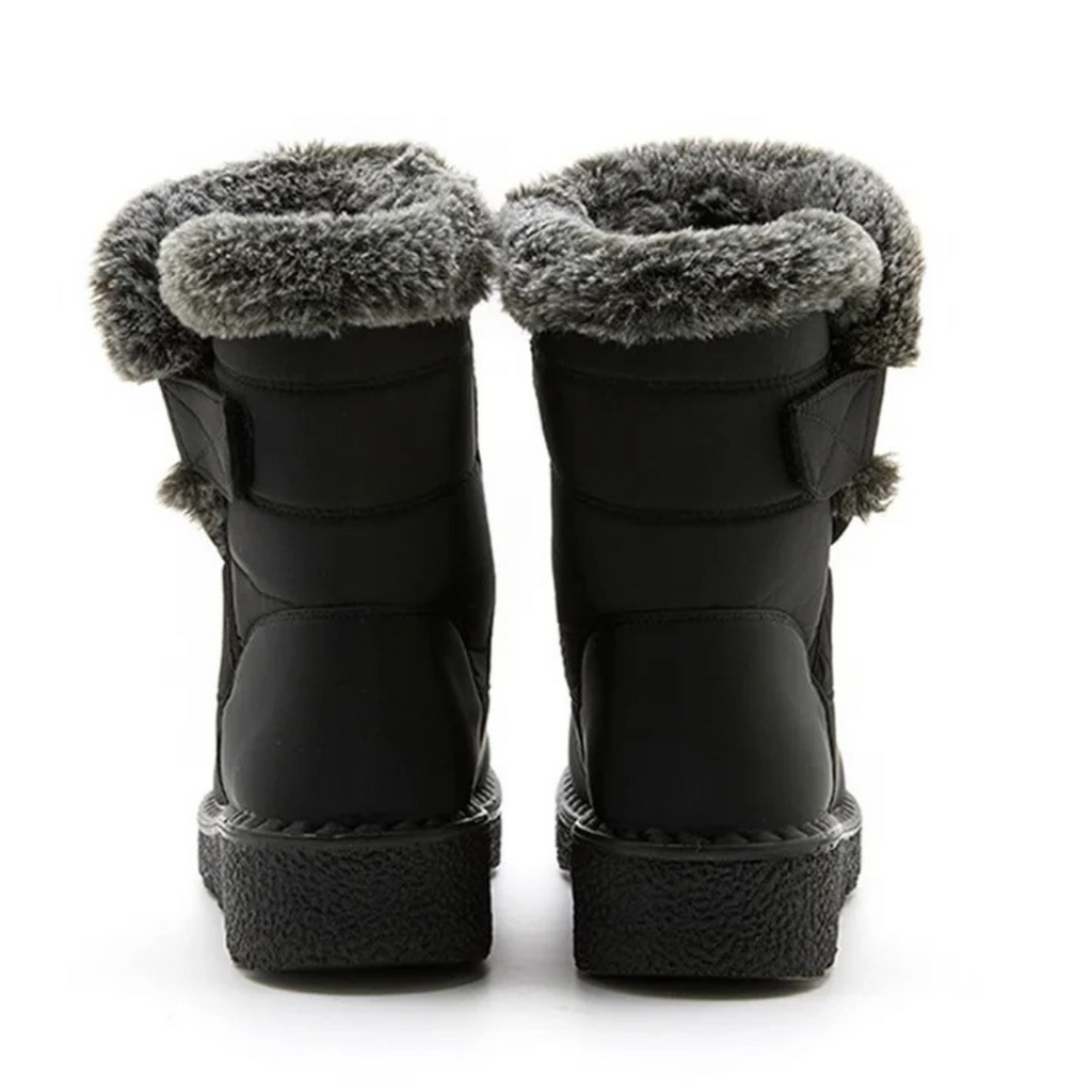 Women's faux fur cuff snow boots in black – back view
