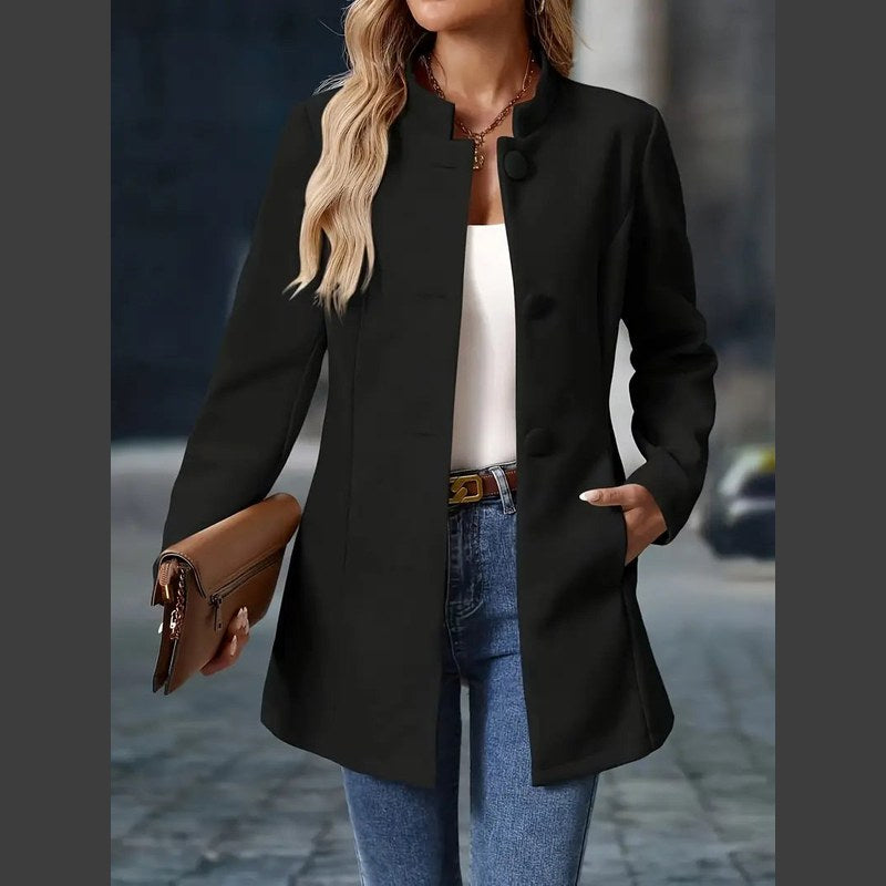 Women's stand collar coat in black – side view with clutch