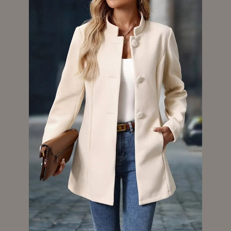 Women's stand collar coat in cream – front view with clutch