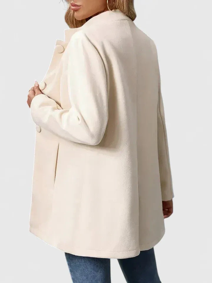Women's fitted stand collar coat in apricot – side view