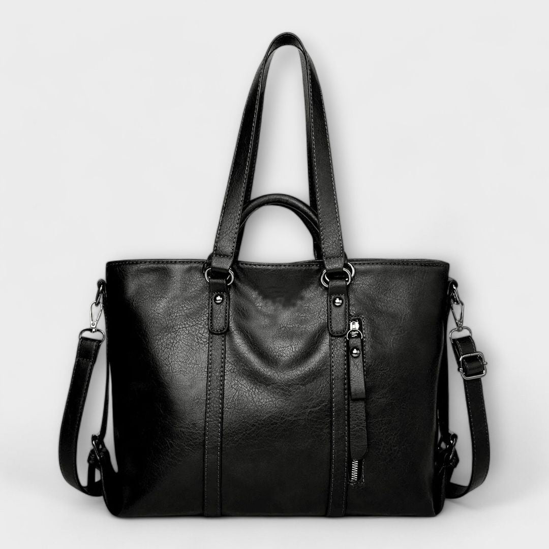 Women's structured leather look tote bag in black, side view
