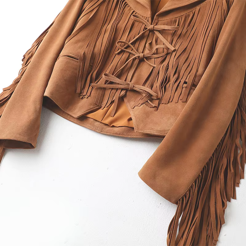 Close-up of the lace-up detail on the brown fringe jacket