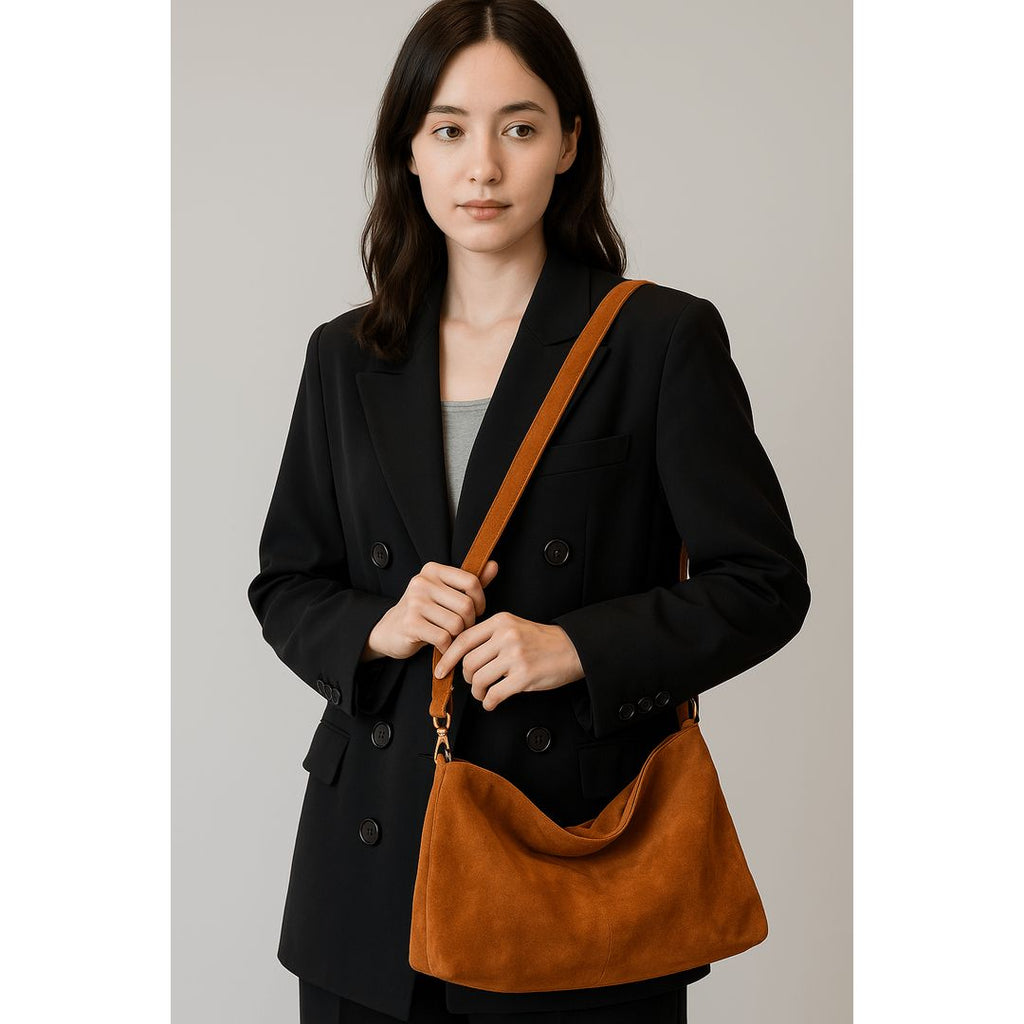 Women's suede look shoulder bag in tan, worn crossbody