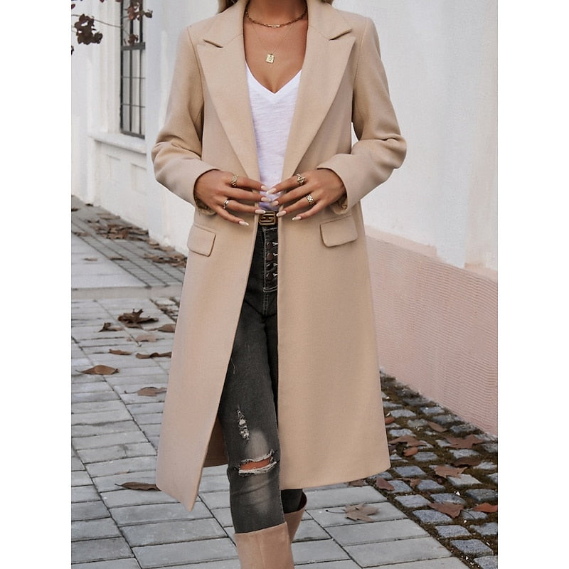 Women's tailored longline coat with lapels in brown – relaxed pose