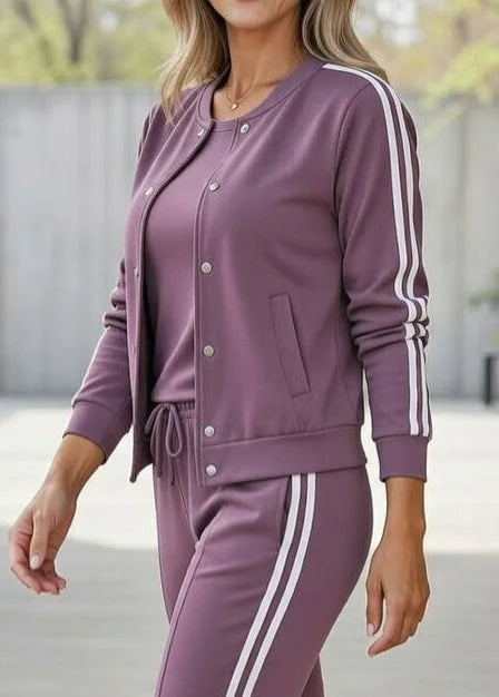 Women's three-piece lounge set in purple – close-up with side stripe