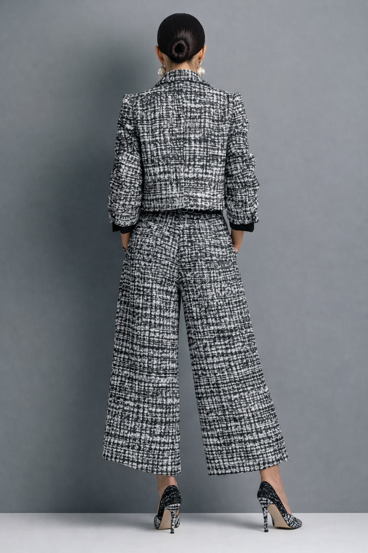 Women's tweed-look jacket and trouser set in black – back view