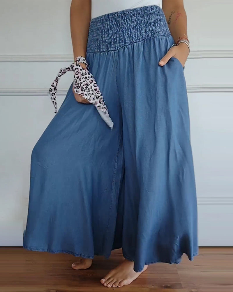 Women's smocked waist wide leg trousers in blue – side view