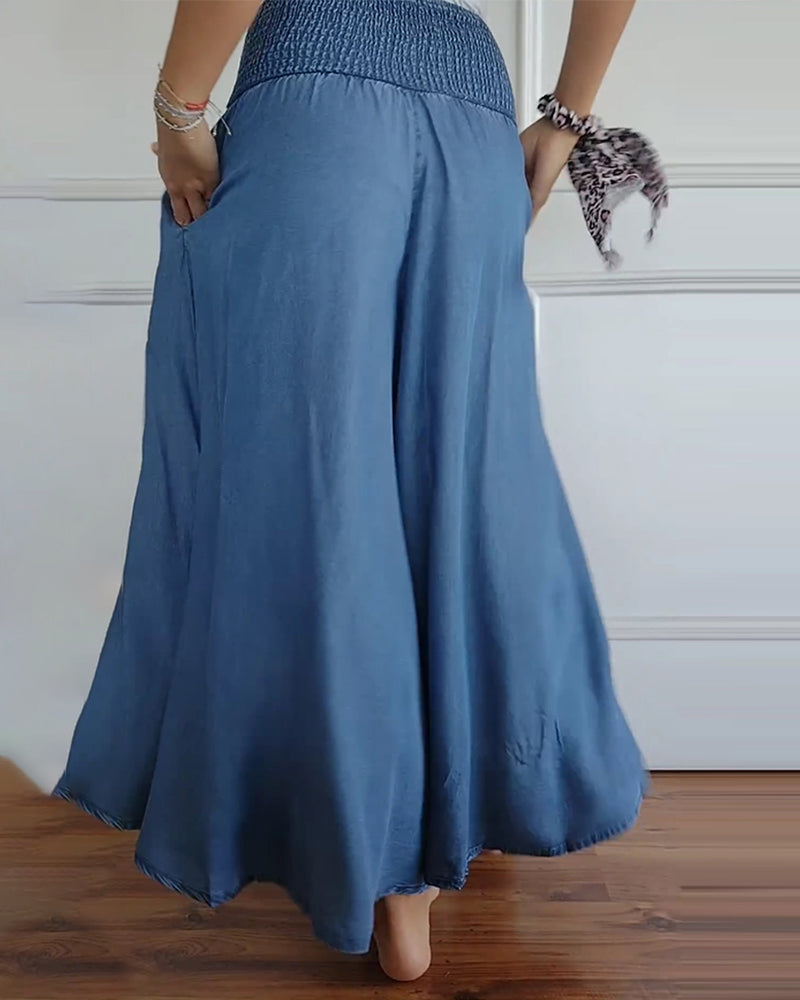 Women's smocked waist wide leg trousers in blue – back view
