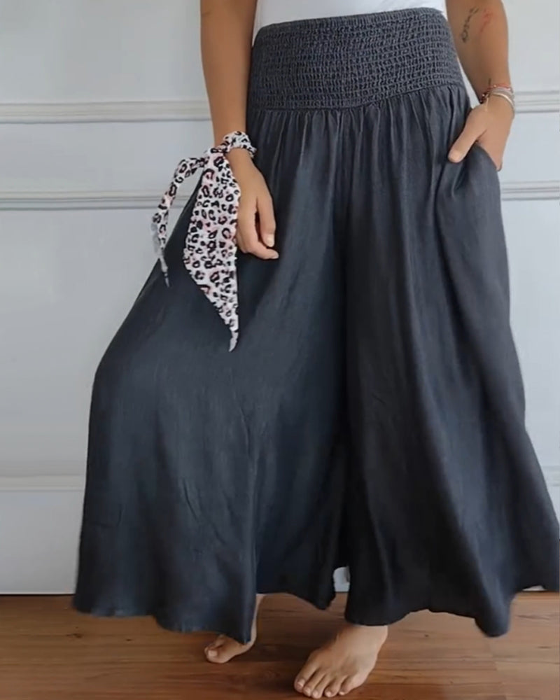Women's smocked waist wide leg trousers in dark grey – side view