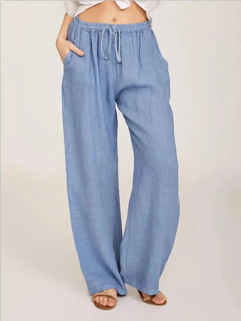 Women's drawstring wide leg trousers in light blue – side view