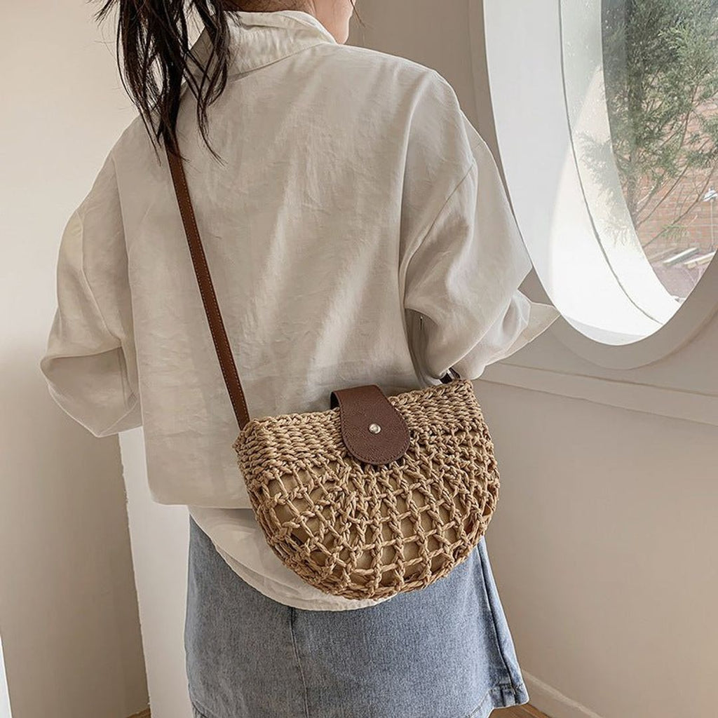 Women's woven crossbody bag with flap in natural, worn crossbody
