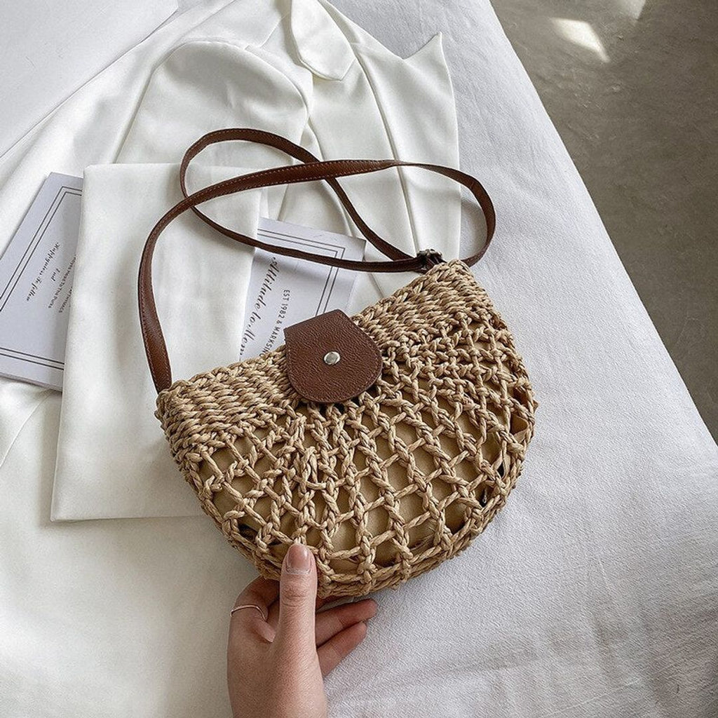 Women's woven crossbody bag with flap in natural, in hand