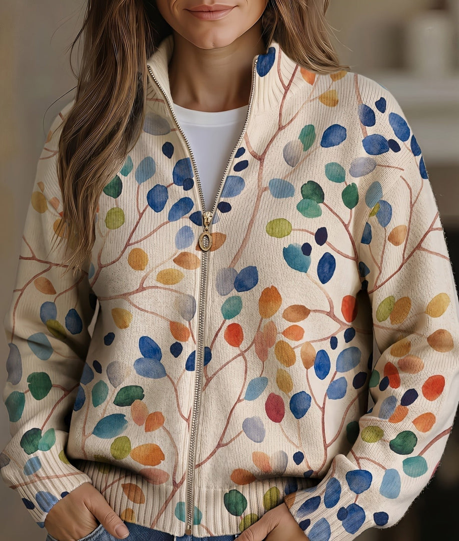 Women's leaf print zip cardigan with colourful leaves on a cream base