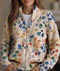 Women's leaf print zip cardigan with colourful leaves on a cream base